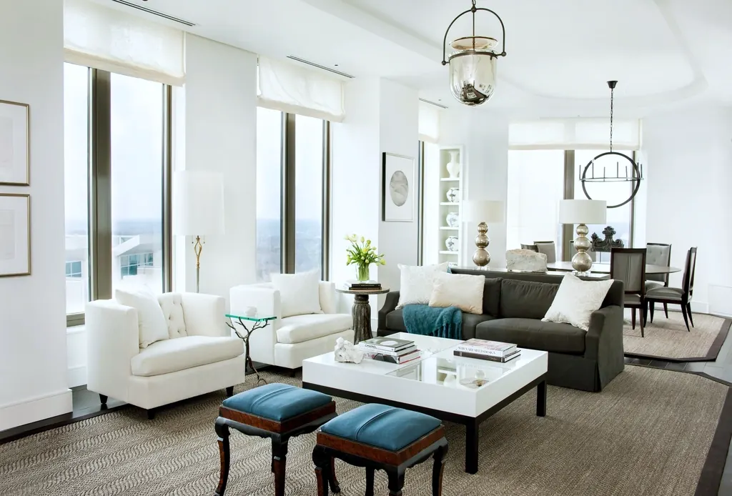 A bright living room with linear ceiling air vents